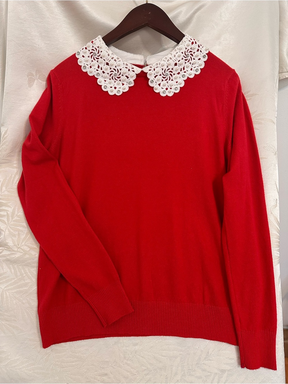 Red Sweater with Decorative White Lace Collar